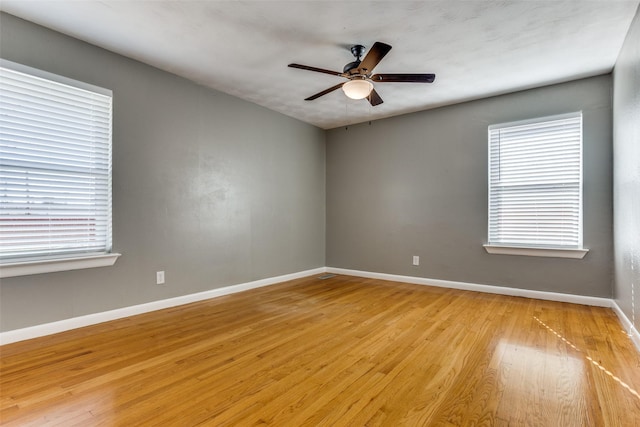 unfurnished room featuring ceiling fan and light wood-type flooring