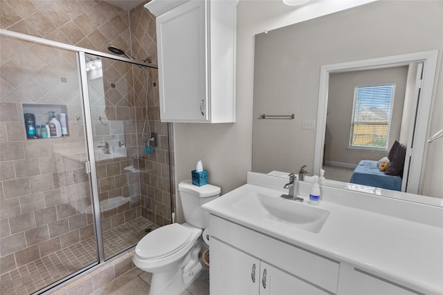 bathroom with walk in shower, tile patterned floors, vanity, and toilet