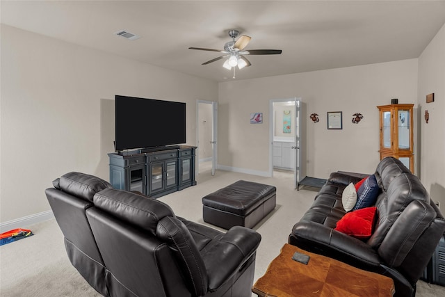 living room featuring light colored carpet and ceiling fan