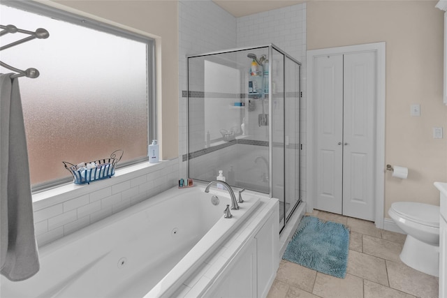 bathroom featuring independent shower and bath, tile patterned flooring, and toilet