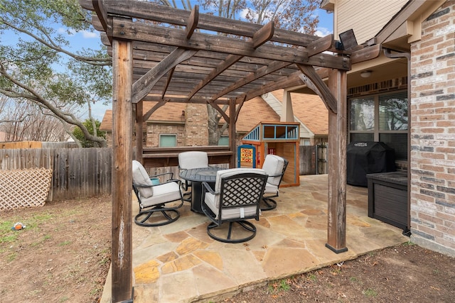 view of patio with a grill and a pergola