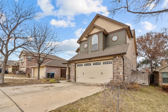 view of front of home featuring a garage and a front yard