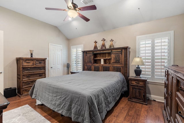 bedroom with ceiling fan, lofted ceiling, and dark hardwood / wood-style floors