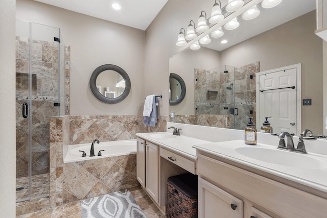 bathroom featuring vanity and shower with separate bathtub