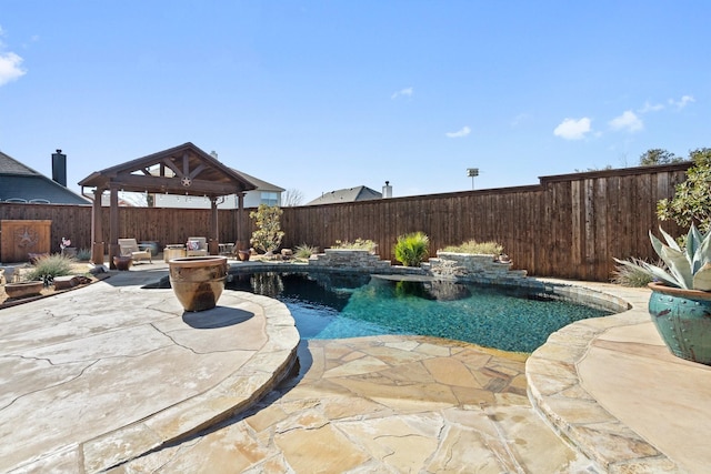 view of pool with a gazebo, pool water feature, and a patio area