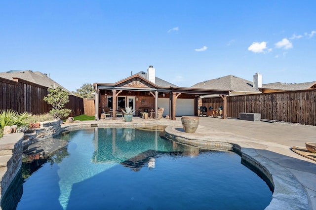 view of swimming pool featuring a patio