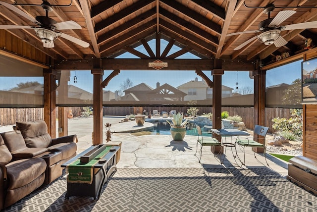 view of patio / terrace with a fenced in pool and a gazebo