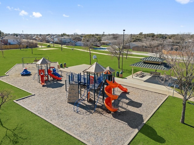 view of playground with a lawn