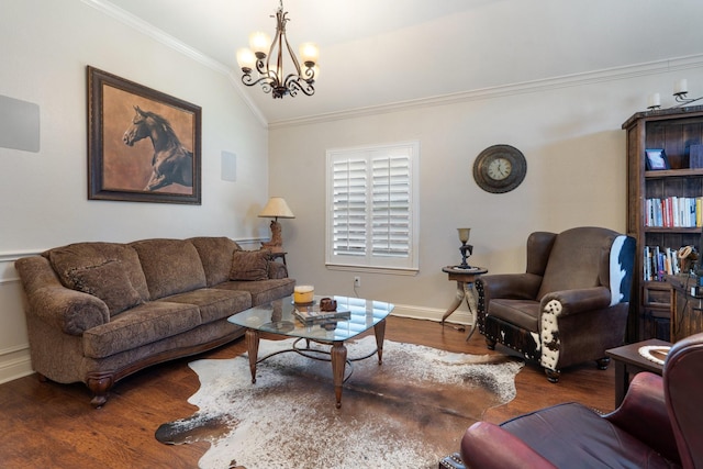 living room featuring ornamental molding, dark hardwood / wood-style floors, a chandelier, and vaulted ceiling