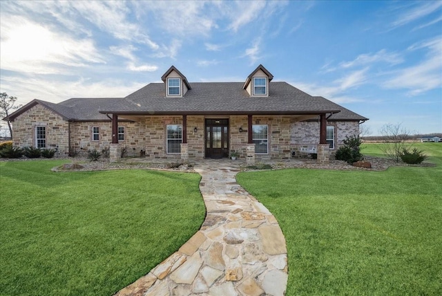view of front facade featuring stone siding and a front yard