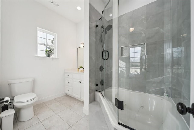 full bathroom featuring enclosed tub / shower combo, vanity, toilet, and tile patterned flooring