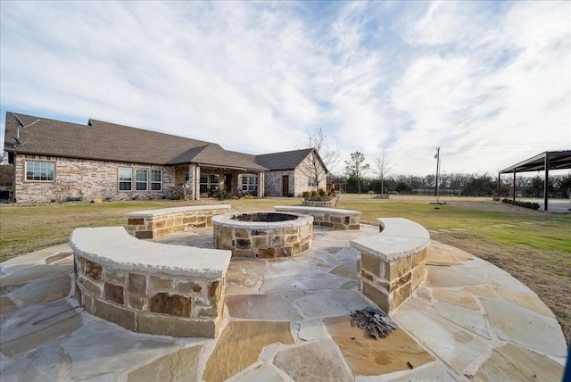 view of patio featuring a fire pit