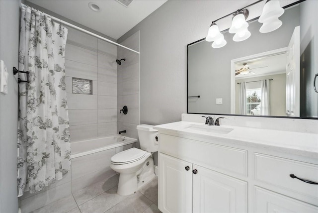 full bath featuring ceiling fan, tile patterned flooring, vanity, shower / tub combo with curtain, and toilet