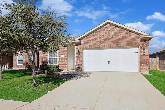 view of front of house featuring a garage and a front yard