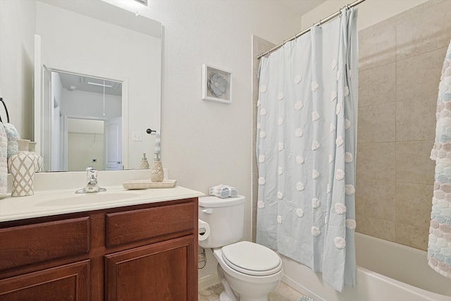 full bathroom featuring shower / tub combo with curtain, vanity, and toilet