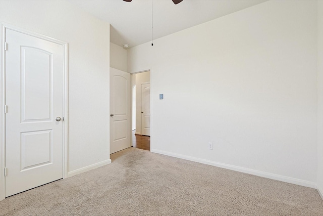 unfurnished bedroom with carpet floors and ceiling fan