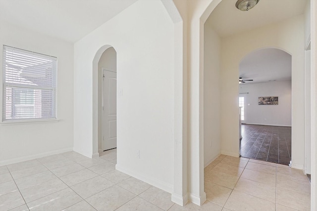 corridor with light tile patterned floors