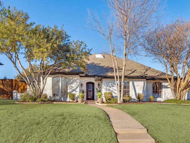 view of front of property with a front lawn