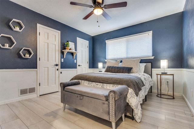 bedroom featuring light hardwood / wood-style flooring and ceiling fan