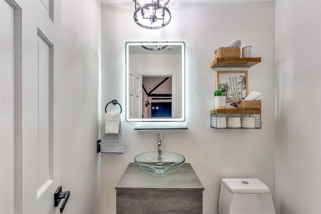 bathroom featuring vanity and toilet