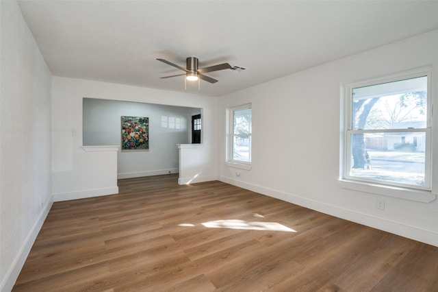 empty room featuring hardwood / wood-style flooring and ceiling fan