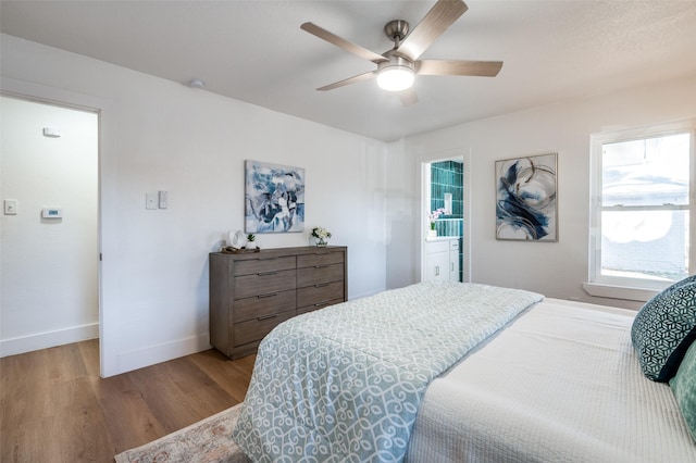 bedroom with ceiling fan and light hardwood / wood-style floors