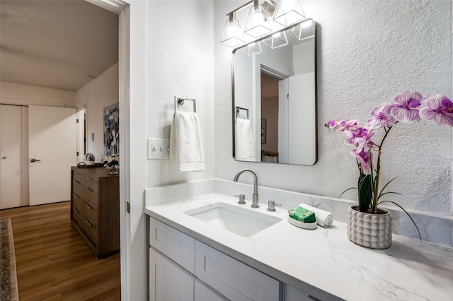 bathroom featuring vanity and wood-type flooring