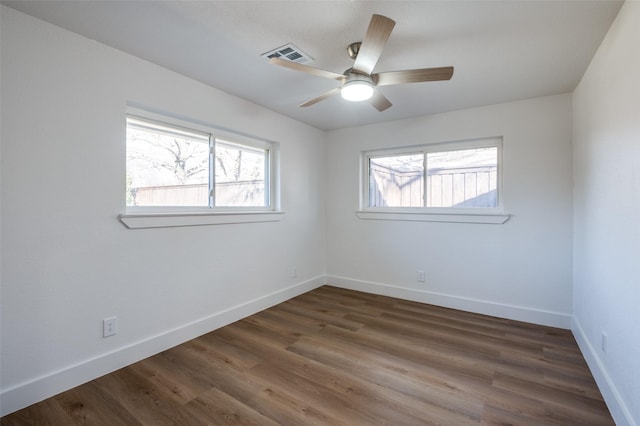 unfurnished room with dark hardwood / wood-style floors and ceiling fan