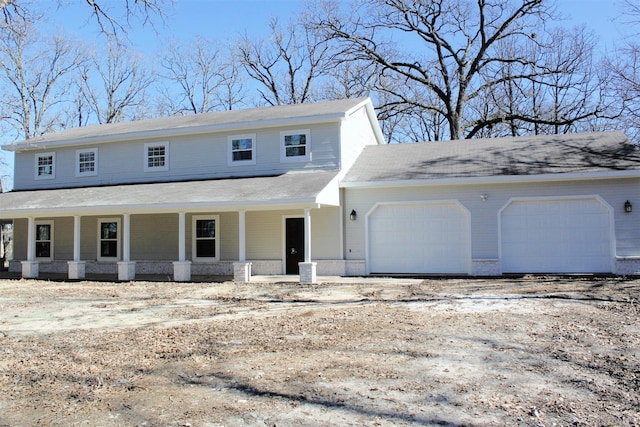 front facade with a garage and a porch