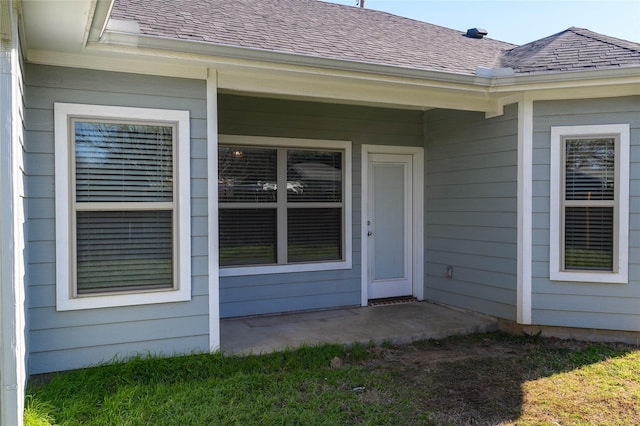 property entrance with a patio area