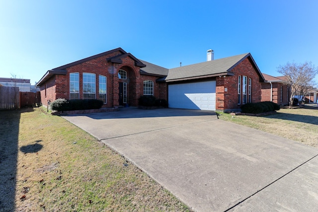 single story home with a garage and a front yard