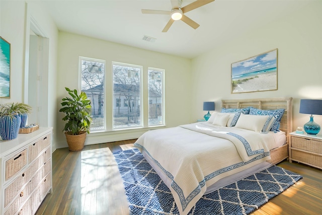 bedroom featuring dark wood-type flooring and ceiling fan