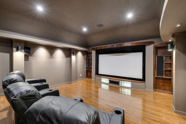 home theater with light wood-type flooring