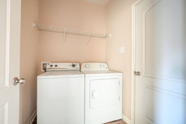 laundry room with separate washer and dryer