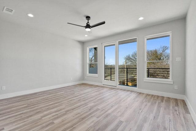 empty room with light hardwood / wood-style flooring and ceiling fan