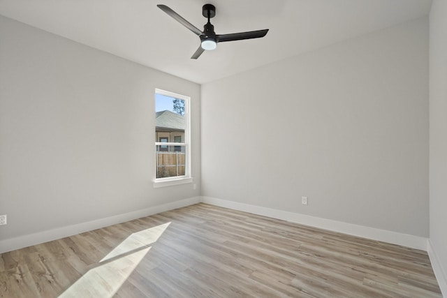 empty room featuring ceiling fan and light wood-type flooring