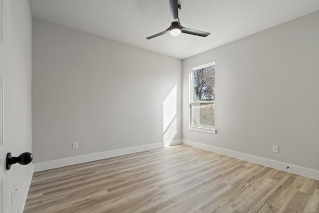 spare room with ceiling fan and light hardwood / wood-style floors