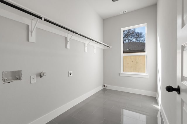 laundry area featuring tile patterned flooring, gas dryer hookup, hookup for a washing machine, and hookup for an electric dryer