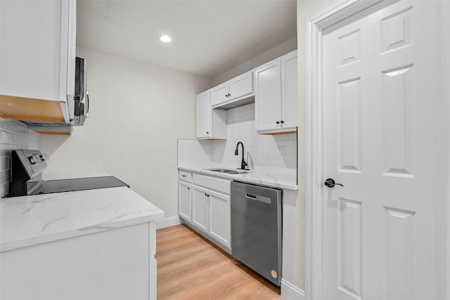 kitchen with white cabinetry, sink, stainless steel appliances, and light stone countertops