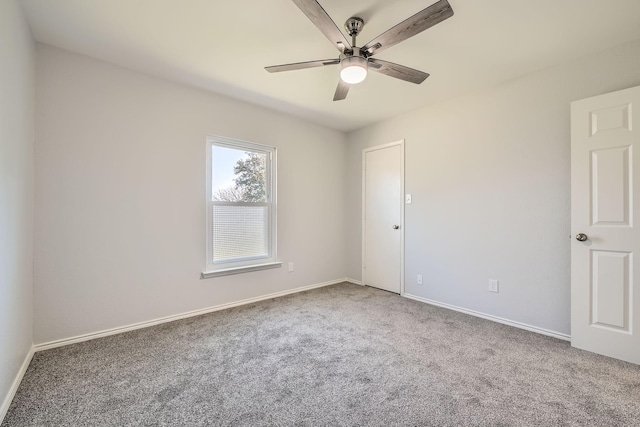 spare room featuring carpet floors and ceiling fan