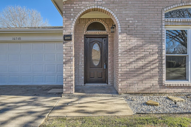 entrance to property featuring a garage