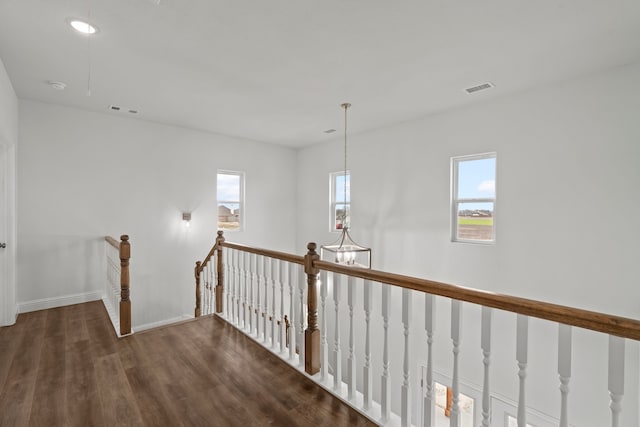 hall with dark hardwood / wood-style floors