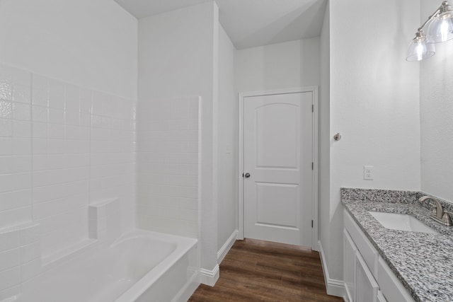 bathroom featuring vanity and hardwood / wood-style flooring