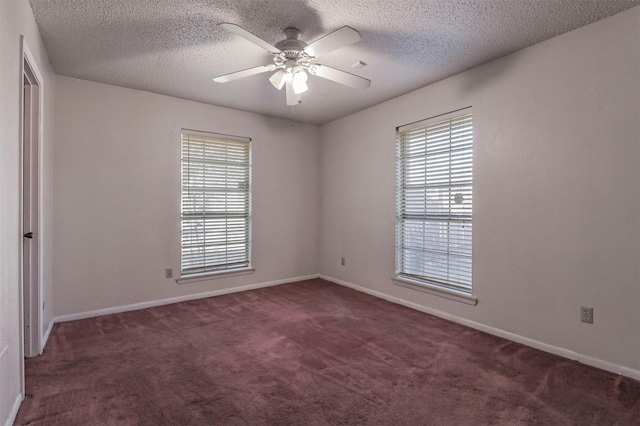 carpeted empty room featuring a textured ceiling and ceiling fan