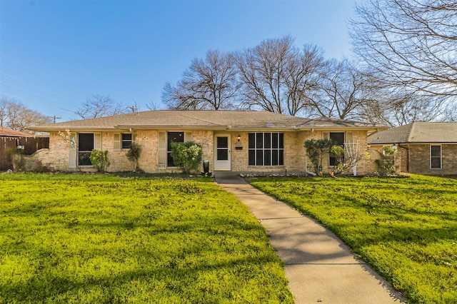 ranch-style house with a front lawn