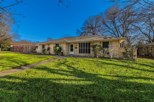 ranch-style home with a front yard