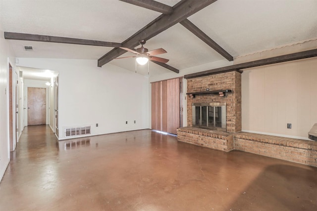 unfurnished living room with ceiling fan, a fireplace, concrete flooring, and lofted ceiling with beams