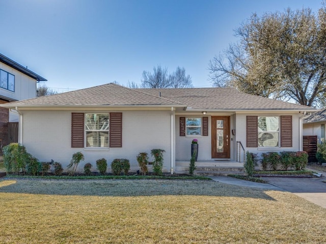 ranch-style house featuring a front yard