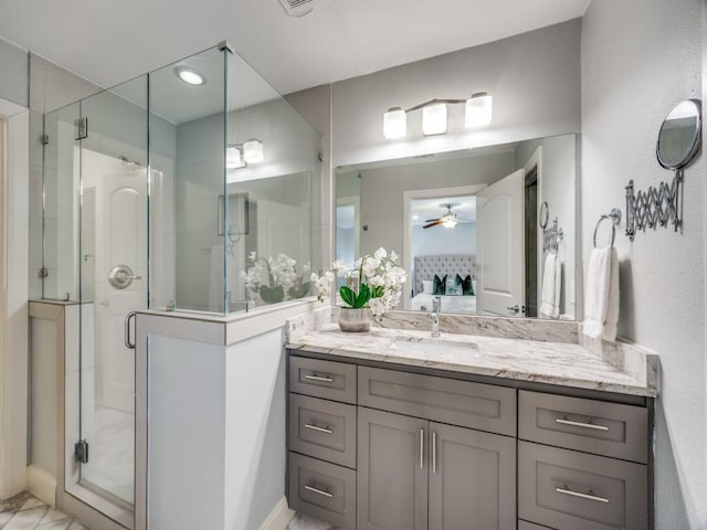 bathroom featuring vanity and an enclosed shower