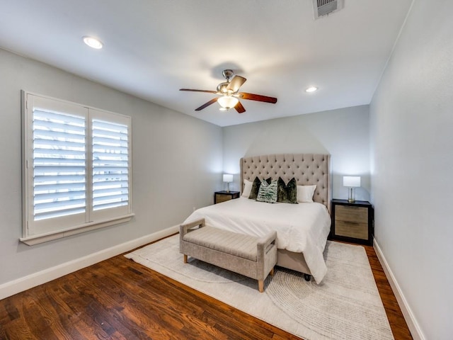 bedroom with ceiling fan and hardwood / wood-style floors